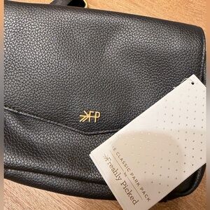 Freshly Picked Black Leather Baby Bag with Gold Logo crossbody.